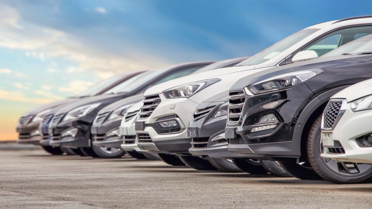 A line of various models of cars and SUVs.