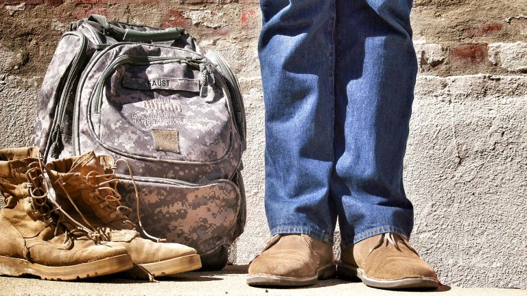 Unidentified Veteran with a backpack and boots.