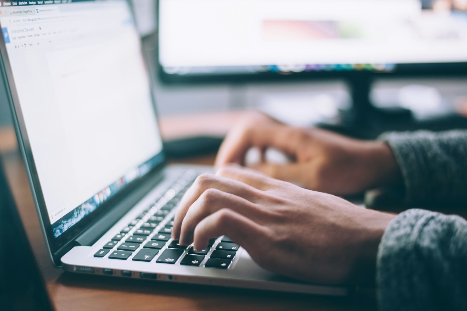 person using laptop to check email.