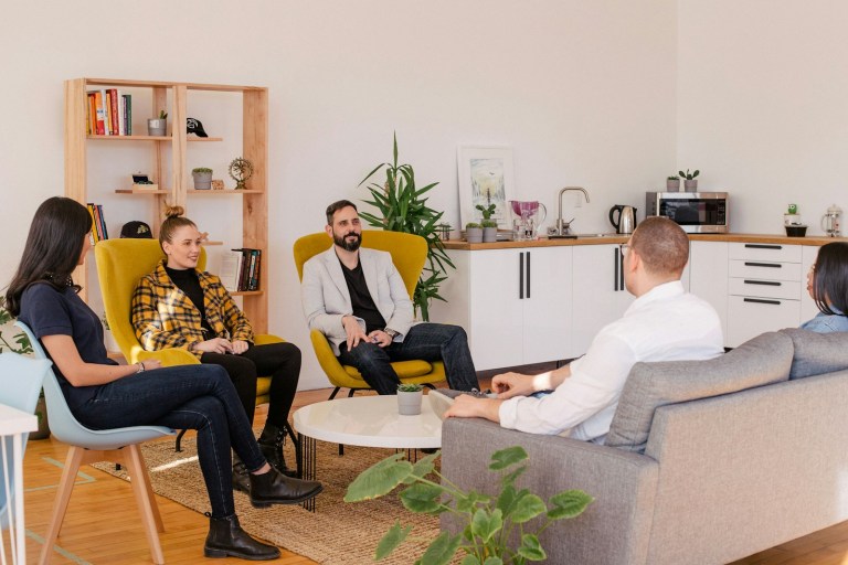 people seated in meeting room